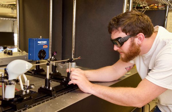 Hardy in lab with laser