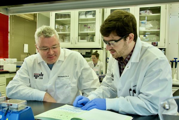 Kirill Afonin and student in lab